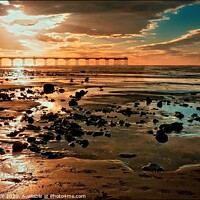 Buy canvas prints of Angel light over Saltburn Beach by ROS RIDLEY
