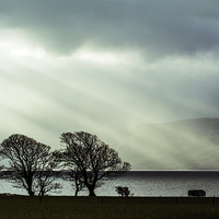 Buy canvas prints of   Crepuscular Rays on the Isle of Bute by Andy Mather
