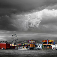 Buy canvas prints of  Funfair on a stormy day in Llandudno by Mal Bray