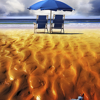 Buy canvas prints of  Deckchairs and Parasol on a Beach by Mal Bray