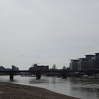 Buy canvas prints of River Thames at Low Tide by John Bridge
