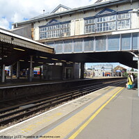 Buy canvas prints of Clapham Junction Footbridge and Platform by John Bridge