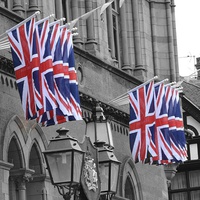 Buy canvas prints of  Union Jacks flying high. by Andrew Heaps
