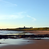 Buy canvas prints of Majestic dawn over Dunstanburgh Castle by Andrew Heaps