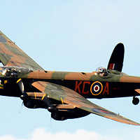 Buy canvas prints of Lancaster bomber in flight Soaring High by Andrew Heaps