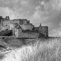 Buy canvas prints of Bamburgh Castle in black and white. by Andrew Heaps