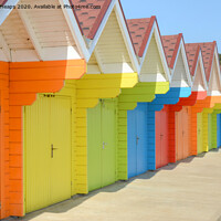 Buy canvas prints of Row of colourful Beach huts in Scarborough.   by Andrew Heaps