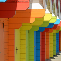 Buy canvas prints of Row of colourful beach huts by Andrew Heaps