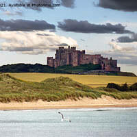 Buy canvas prints of Majestic Bamburgh Castle Standing Tall by Andrew Heaps