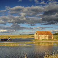 Buy canvas prints of  Thornham coal shed at high tide by Simon Taylor