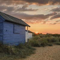 Buy canvas prints of Beach hut sunset in the dunes by Simon Taylor