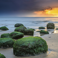 Buy canvas prints of Hunstanton Sunset on the rocks by Simon Taylor