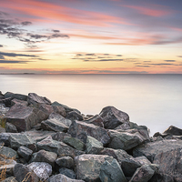 Buy canvas prints of  Brancaster sunset on the rocks, Norfolk by Simon Taylor