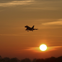 Buy canvas prints of  A Typhoon lands at sunset by Philip Catleugh