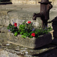 Buy canvas prints of  The Village Pump, Castle Combe by Andrew Wright