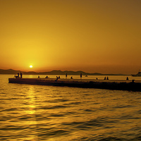 Buy canvas prints of  Croatian Pier Sunset . by William Duggan