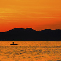 Buy canvas prints of  Croatian Sunset Fishing Boat. by William Duggan