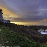 Buy canvas prints of Setting sun behind Flamborough Lighthouse by Andrew Ray