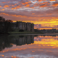 Buy canvas prints of Sunset at Carew Castle by Andrew Ray