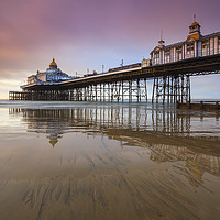 Buy canvas prints of Reflections at sunrise (Eastbourne Pier) by Andrew Ray
