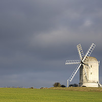 Buy canvas prints of Stormy clouds behind Ashcombe Windmill by Andrew Ray