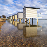 Buy canvas prints of Osea Beach Hut reflections by Andrew Ray