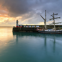 Buy canvas prints of Newlyn South Pier at sunrise by Andrew Ray