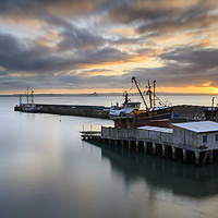 Buy canvas prints of Sunrise over the dry dock at Newlyn by Andrew Ray