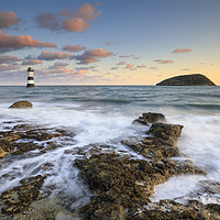 Buy canvas prints of Rocks at sunrise (Penmon) by Andrew Ray