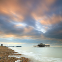 Buy canvas prints of Brighton Piers at sunrise by Andrew Ray