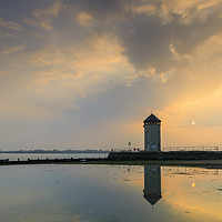 Buy canvas prints of The setting sun behind Batemans Tower (Brightlings by Andrew Ray