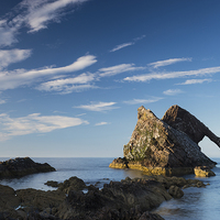 Buy canvas prints of Evening light on Bowfiddle Rock by Howard Kennedy