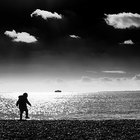 Buy canvas prints of The Boy on The Beach by Simon Rutter