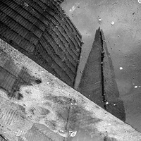 Buy canvas prints of  The Shard as seen in a puddle by Jeremy Moseley