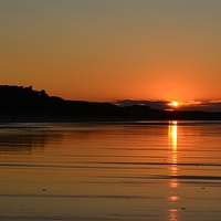 Buy canvas prints of  Bamburgh Castle at Sunset by Carolyn Farthing-Dunn