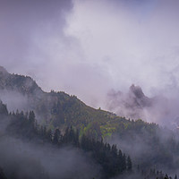 Buy canvas prints of Mist on the mountains by Louise Wilden