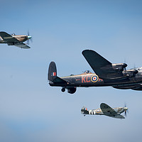 Buy canvas prints of Lancaster bomber in flight by Louise Wilden