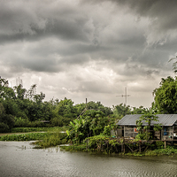 Buy canvas prints of  House on the river by Dave Rowlands