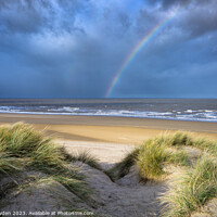 Buy canvas prints of Rainbow over Holkham Bay Dunes. by Rick Bowden