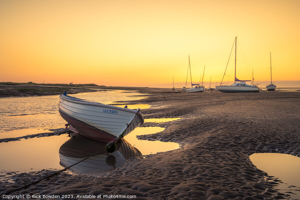 A Glowing Sunrise on the Brancaster Staithe Picture Board by Rick Bowden