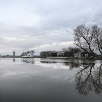Buy canvas prints of Reflections of Trees At Thurne by Rick Bowden