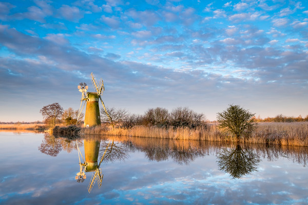 Serene Sunrise at Turf Fen Mill Picture Board by Rick Bowden