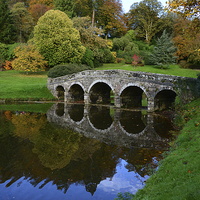 Buy canvas prints of Bridge at Stourhead during Autumn by Jonathan Evans