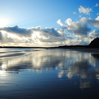 Buy canvas prints of Tenby beach in winter blue reflection by Jonathan Evans