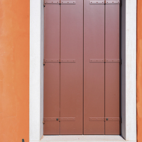 Buy canvas prints of Red Door and orange surround in Venice, Italy  by Jonathan Evans