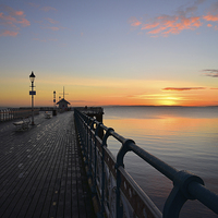 Buy canvas prints of Penarth Pier in vale of Glamorgan sunrise over the by Jonathan Evans
