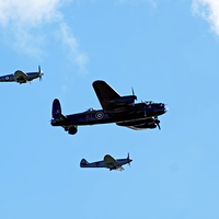Buy canvas prints of Lancaster bomber and escorts by Susan Tinsley