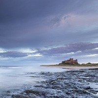 Buy canvas prints of Bamburgh Castle at Dusk by Seán Kerr