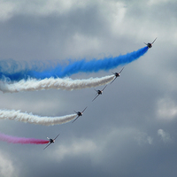 Buy canvas prints of  The red arrows aerobatic display team flying thro by James Tully