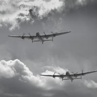 Buy canvas prints of  The silver lining of two RAF Lancaster bombers by James Tully